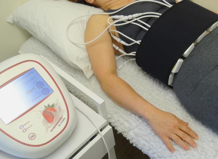 Person with red light therapy strip across their waste